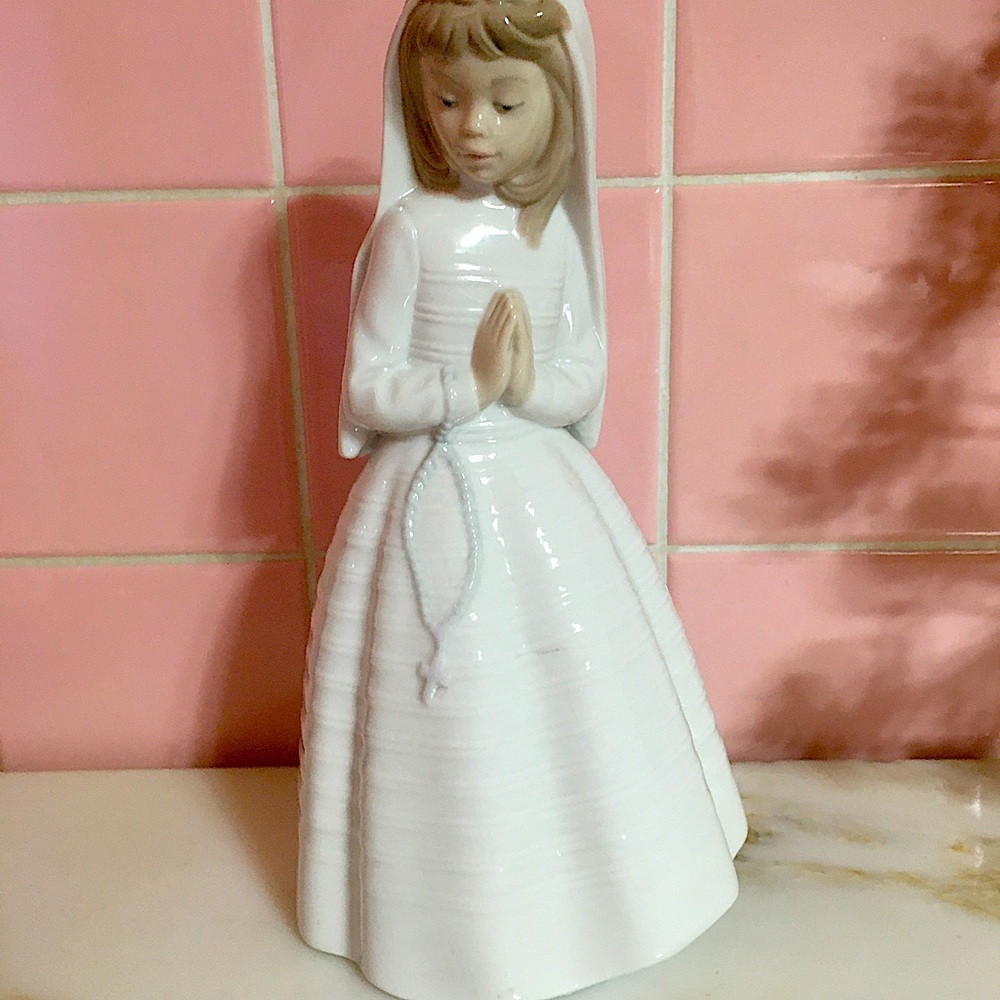 NAO by Lladro first communion figurine. Offering much lower than retail.